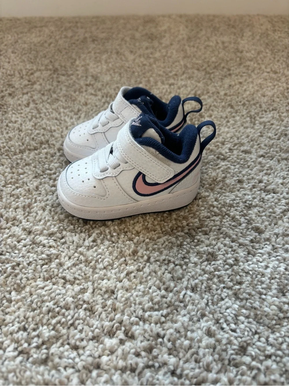 Nike Kids White Sneakers with Navy Lining and Pink Swoosh